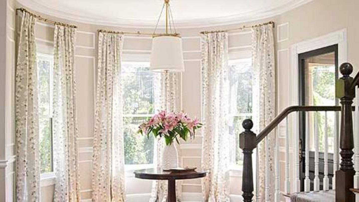 Floor-to-ceiling curtains help elevate the space Floor-to-ceiling curtains help elevate the space