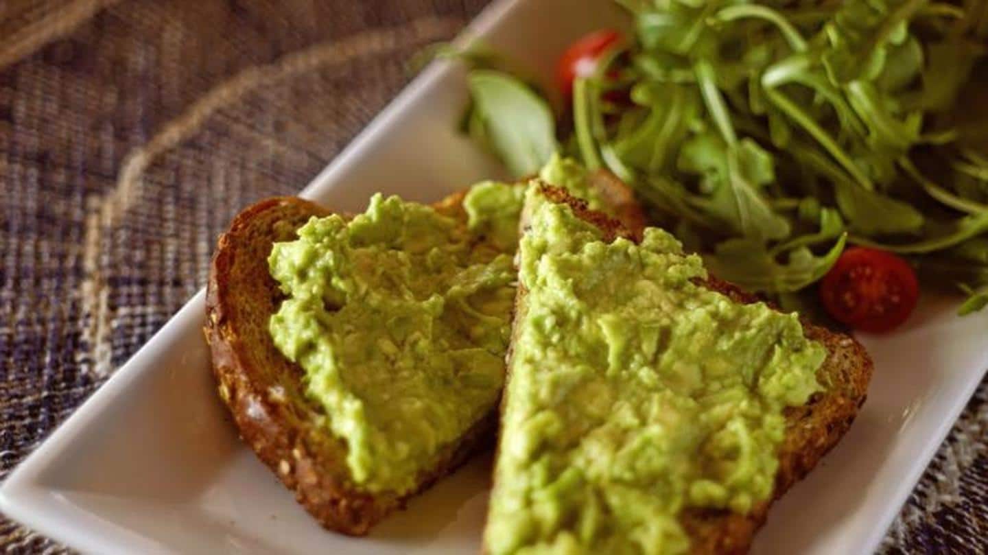 Mashed avocado on sprouted grain bread for your breakfast Mashed avocado on sprouted grain bread for your breakfast