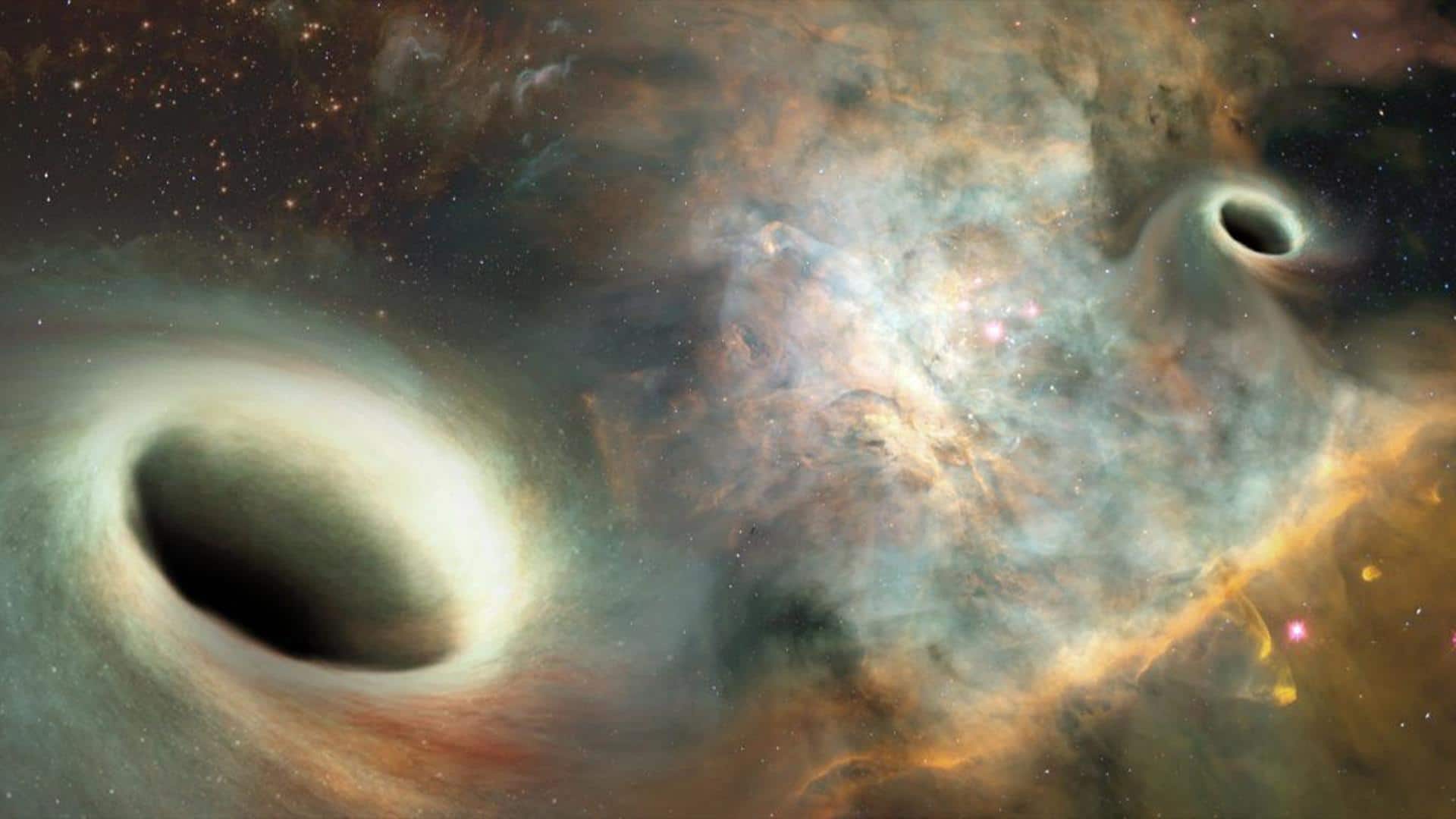 Historic image reveals two black holes orbiting each other Historic image reveals two black holes orbiting each other