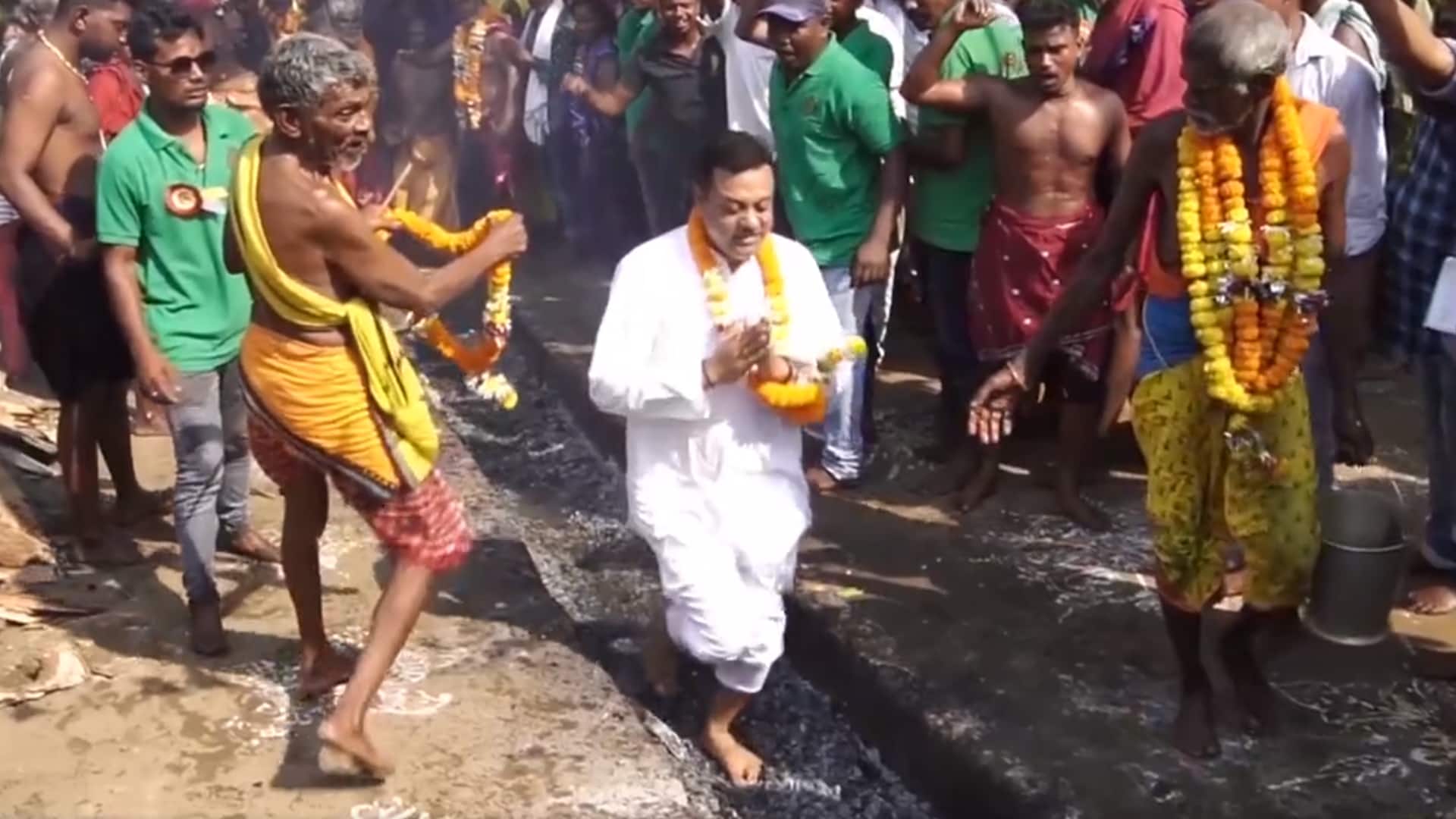 Odisha: BJP's Sambit Patra walks barefoot on burning coal bed