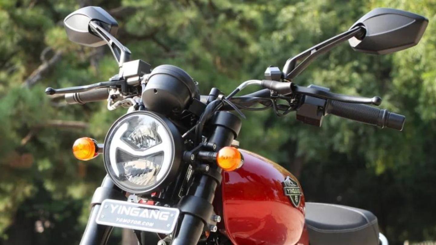 The bike has a round headlamp and flat seat The bike has a round headlamp and flat seat