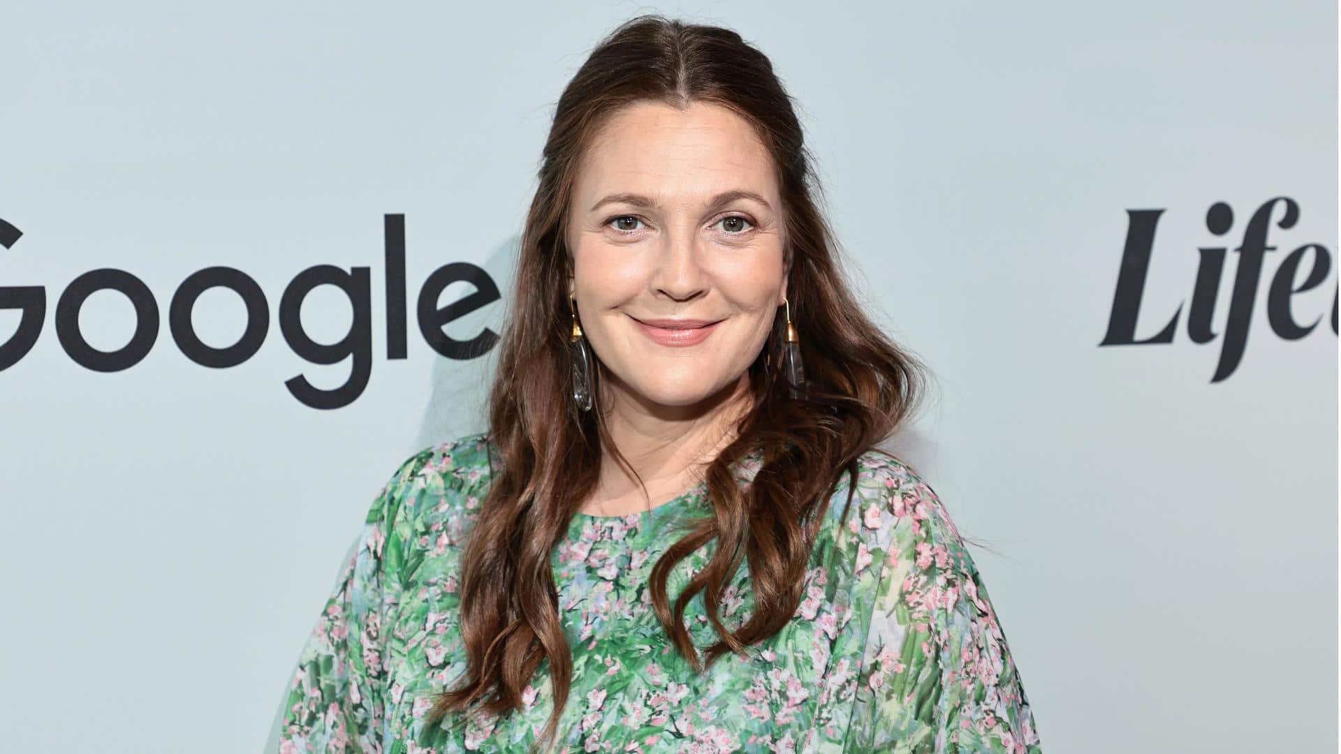 Drew Barrymore condemns tabloid's fabricated story about wishing mother's death