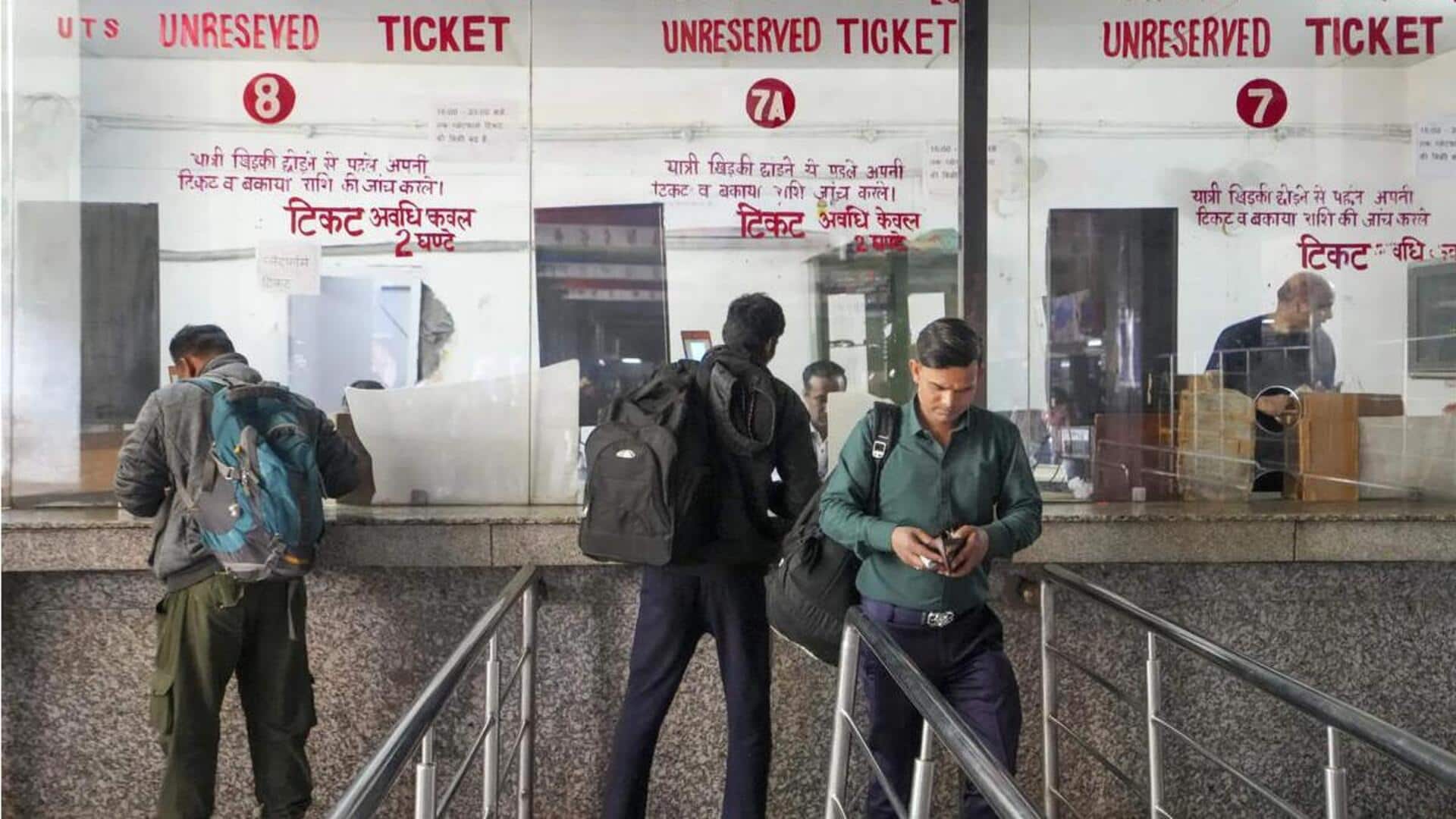 Train passengers buying tickets at counters to get insurance cover