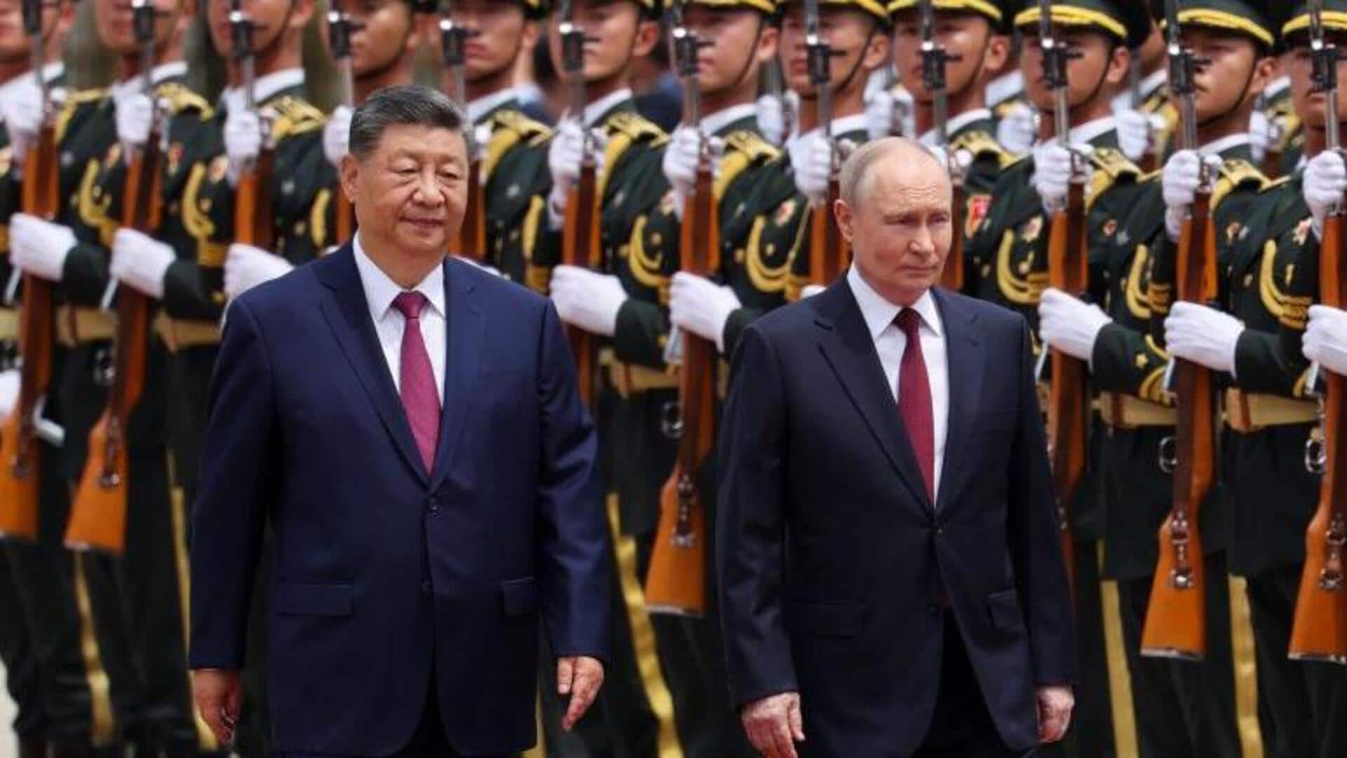 Xi, Putin meet in Beijing among pomp and pageantry 
