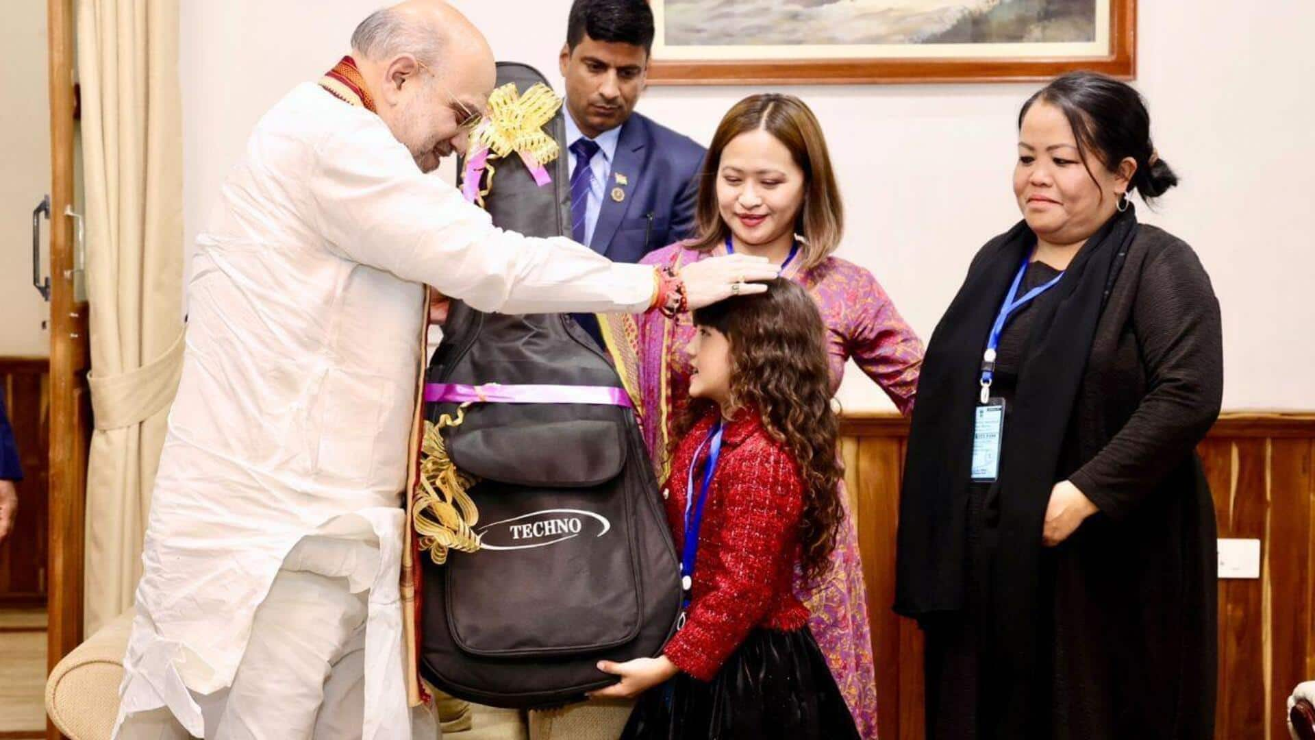 Amit Shah gifts guitar to Mizoram's 7-year-old singing sensation