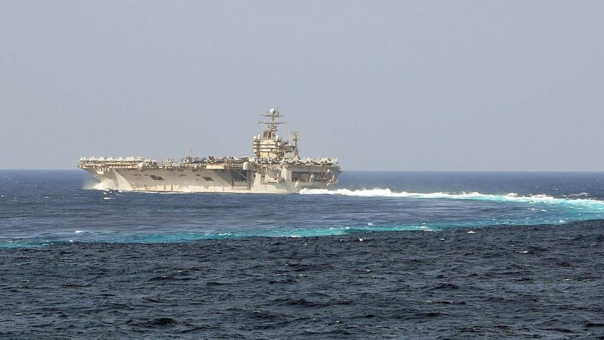 US aircraft carrier struck by 4 ballistic missiles, says Iran