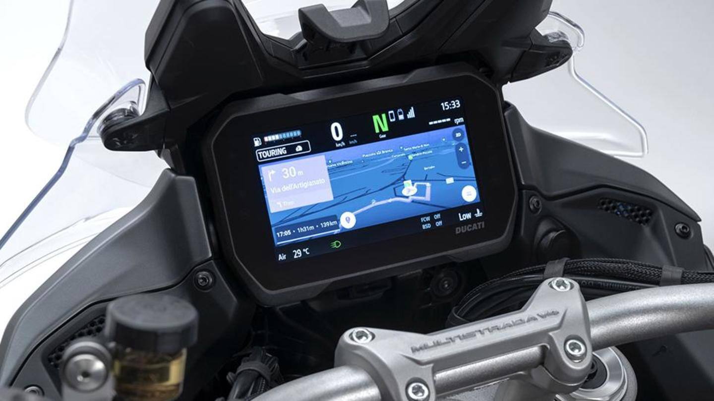 The bike has spoked wheels and a digital instrument console The bike has spoked wheels and a digital instrument console