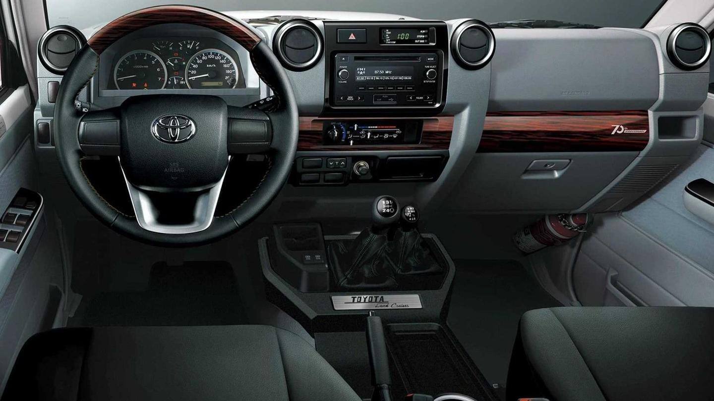 The vehicle offers black upholstery and a 3-spoke steering wheel The vehicle offers black upholstery and a 3-spoke steering wheel