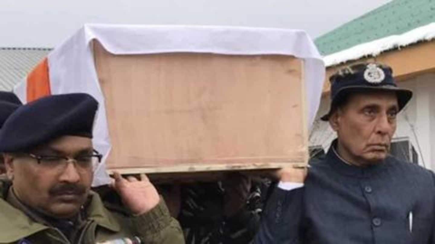 #PulwamaAttack: Home Minister Rajnath Singh carries coffin of martyred jawan