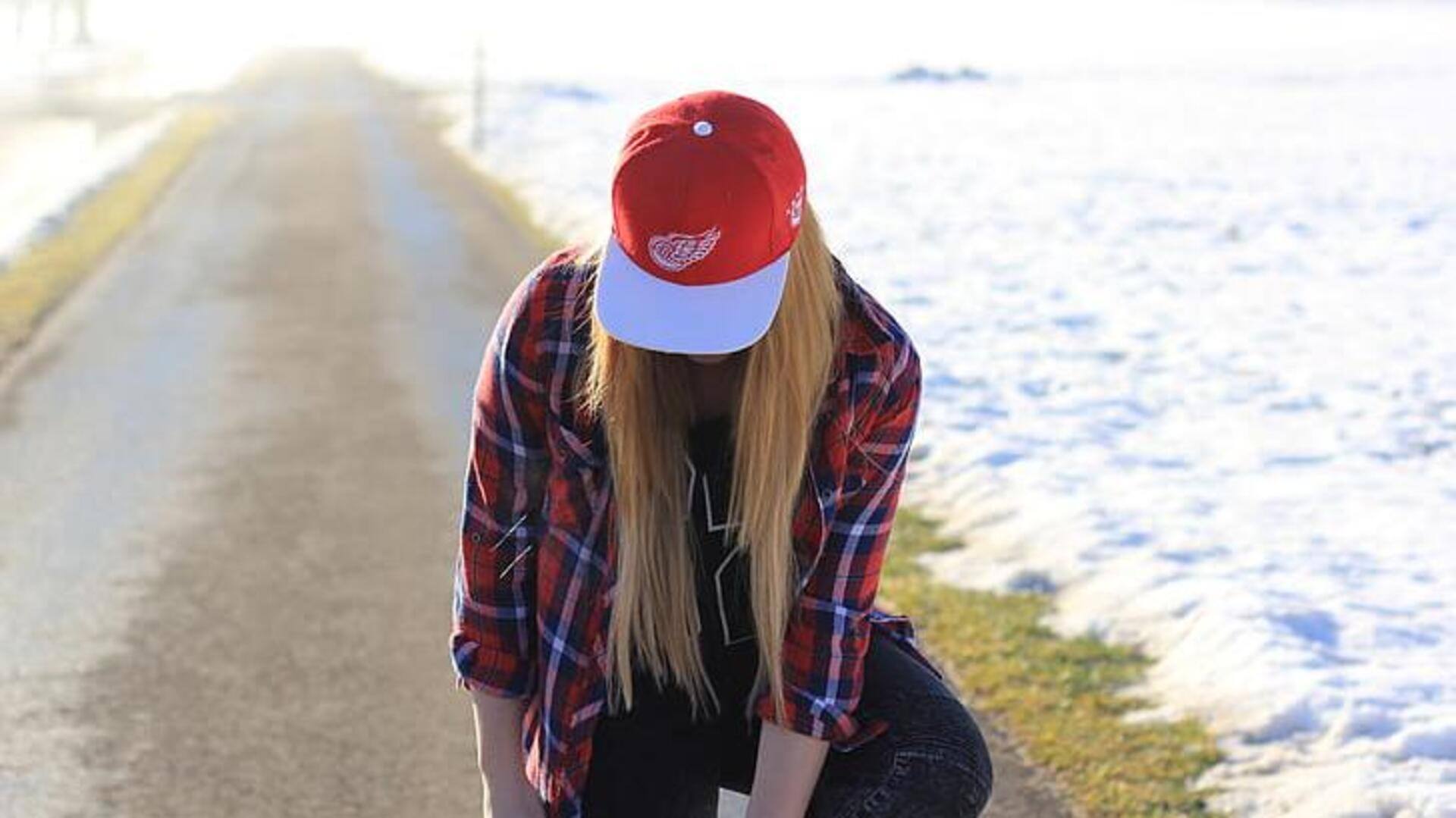 Mengapa topi baseball memiliki kancing di atasnya?